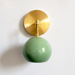 pale green and brass midcentury modern inspired globe wall lighting sconce