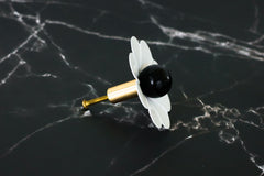 White and black daisy drawer pull cabinetry knob