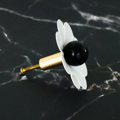White and black daisy drawer pull by sazerac stitches