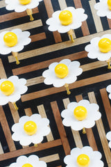 White and yellow daisy drawer pulls.
