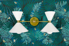 White and Brass mid century modern two light wall sconce on jungle wallpaper in greens and teals