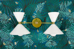 White and Brass mid century modern two light wall sconce on jungle wallpaper in greens and teals