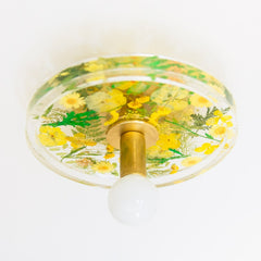 Ceiling light with yellow flowers and green leaves with brass details.  Ceiling light fixture