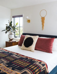 Boho Bedroom Design with articulating west end sconces