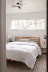 Neutral bedroom with mid century modern flush mount ceiling fixture
