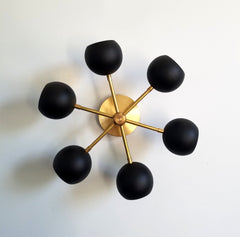 black and brass mid century styled modern wall sconce flushmount modern lighting