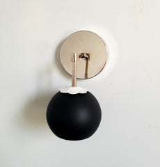 black and chrome eyeball shade wall sconce with daisy shade