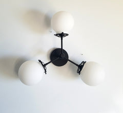 3 light ceiling or wall fixture black with white globe shades