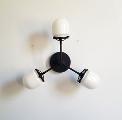 Black bicycle club with white tube shade ceiling fixture