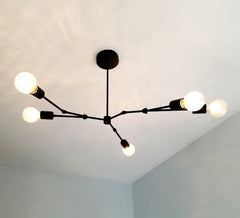 Black modern asymmetric chandelier lighting mid century organic design home renovation dining room