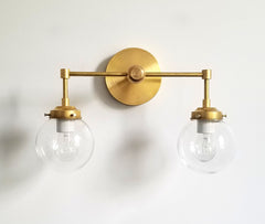 Brass and clear glass two light modern wall sconce bathroom lighting