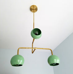 light green and gold brass mid century inspired periscope chandelier lighting fixture with globe shades