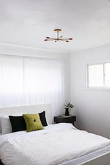 Medium Carousel Chandelier in a small guest bedroom with modern midcentury modern inspired design