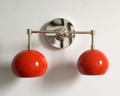 Chrome and orange mid century style wall sconce