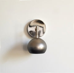 Chrome and Steel Loa sconce with eyeball shade