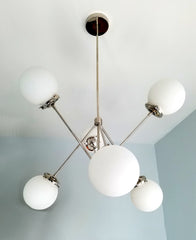 white glass and chrome modern angular chandelier light fixture for traditional meets modern home renovation