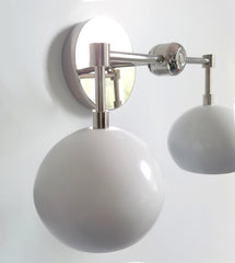 chrome and white eyeball shade wall sconce