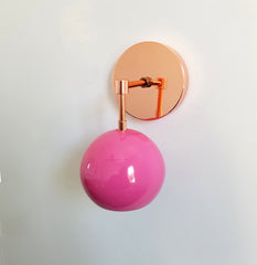 bright pink and copper modern eyeball shade wall sconce nursery decor mid century modern inspired