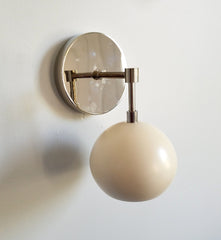 chrome and cream globe shaped wall light