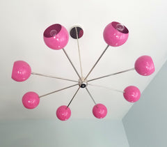 bright pink fuscia and chrome modern eyeball shade italian midcentury inspired nursery decor bright lighting colorful design contemporary modern minimalism
