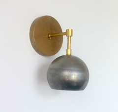 raw brass and steel eyeball shade sconce