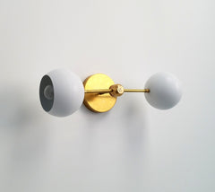 Linear horizontal modern sconce wall lighting globe shade brass and white 