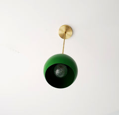 midcentury modern inspired globe pendant lighting in bright green and brass