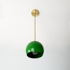 midcentury modern inspired globe pendant lighting in bright green and brass
