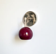 chrome and maroon single wall sconce with eyeball shade
