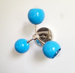 chrome and bright blue wall sconce flushmount mid-century modern design globe shaped colorful nursery decor