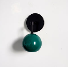 sleek matte black and emerald green wall sconce