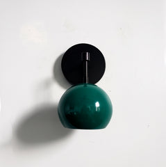 sleek matte black and emerald green wall sconce