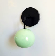 Mint and matte black single light wall sconce with a globe shade midcentury modern minimalism vanity task lighting