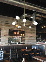 Brass modern chandelier sazerac stitches glass globes
