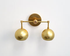 Double Loa Sconce in Raw Brass