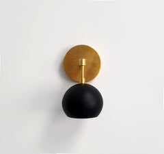 black modern bathroom scone wall lighting brass eyeball shade