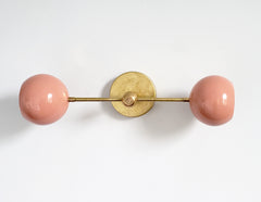 peach and brass midcentury modern inspired accent lighting wall sconce globe shades