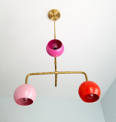multicolored pink and gold mid century modern chandelier with colorful pink and orange globes