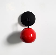 red and black mid century modern wall sconce eyeball globe shade accent lighting