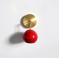 red and brass mid century modern globe wall sconce