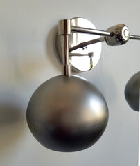 steel and chrome eyeball shade wall light