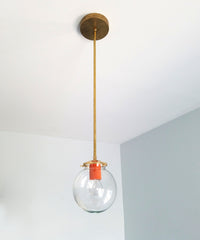 Brass and orange pendant light clear glass