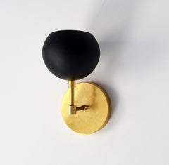 black modern bathroom scone wall lighting brass eyeball shade