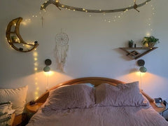 Vista green and black sconces in a boho bedroom
