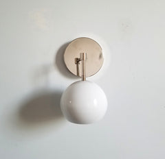 chrome and white eyeball shade globe shaped wall sconce vanity bathroom lighting modern design minimalism minimalistic scandinavian neutral decor