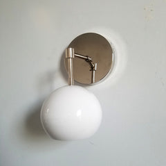 chrome and white eyeball shade globe shaped wall sconce vanity bathroom lighting modern design minimalism minimalistic scandinavian neutral decor
