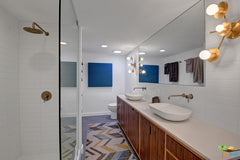 Zodiac sconces in a modern bathroom remodel