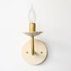 Cream and Brass feminine wall sconce with scalloped bobeche detail