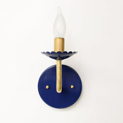 Navy and Brass feminine wall sconce with scalloped bobeche detail