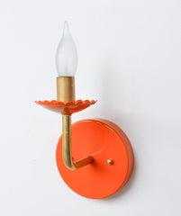 Orange and Brass feminine wall sconce with scalloped bobeche detail